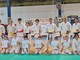 foto (in ordine) di gruppo finale, foto diplomi Dan, con il Maestro Carcassi, foto nuovi allenatori, istruttori e foto diplomi di kyu